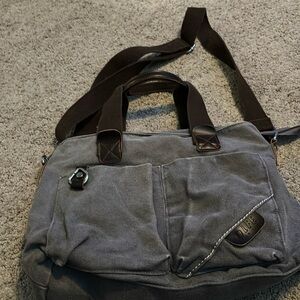 Tolfe. Gray canvas crossbody bag.